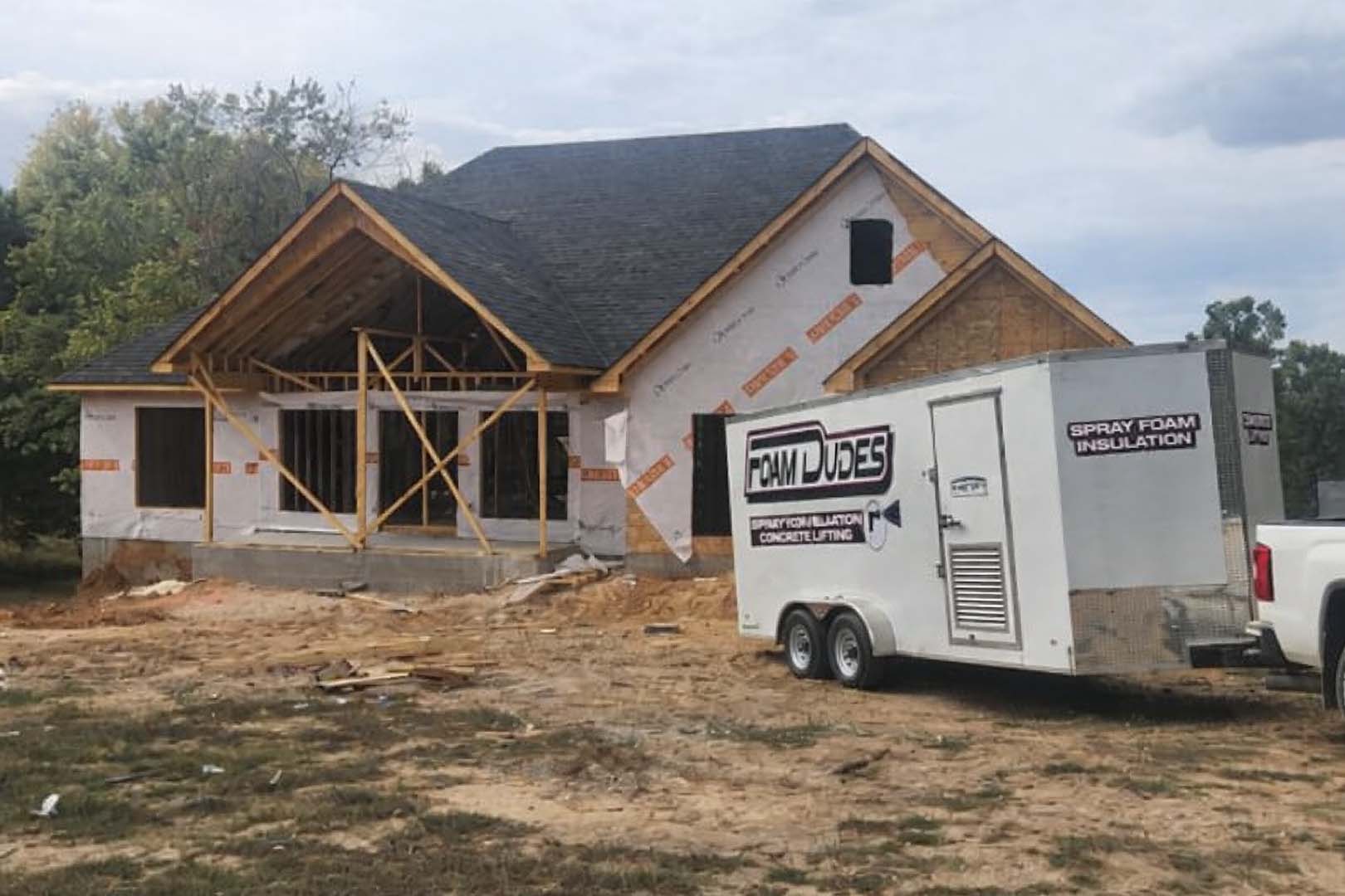 image of one of our Foam Dudes trucks at a new home under construction. They are there to apply spray foam insulation to this home in Paragould AR